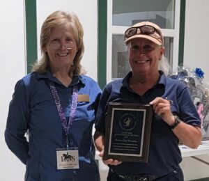 Bess Bruton R9 Director presenting Barbara Richardson-Lewis the 2025 Region 9 Horse Person of the Year Award 